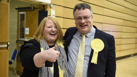 Stephen Farry celebrates with Alliance Party leader Naomi Long