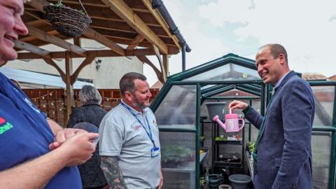 The Duke of Cambridge speaking with volunteers