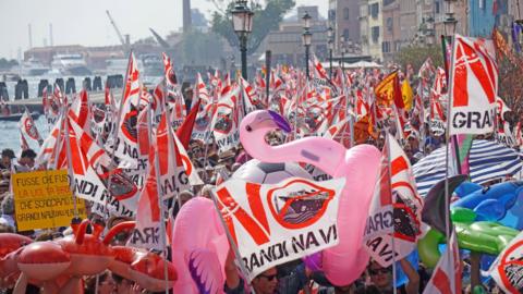 People gather during a demonstration against cruise ships being allowed in the Lagoon of Venice