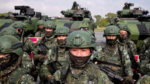 Taiwanese soldiers take part in a demonstration showing their combat skills during a visit by Taiwan's President Tsai Ing-wen at a military base in Chiayi on 6 January , 2023.