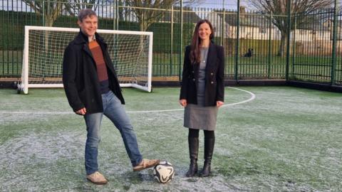 Councillors Robin Bennett and Maggie Filipova-Rivers on the pitch