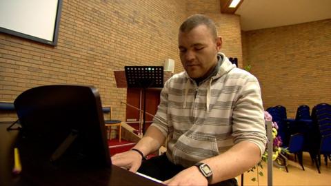 man playing piano