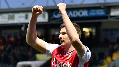 Wrexham striker Paul Mullin celebrates