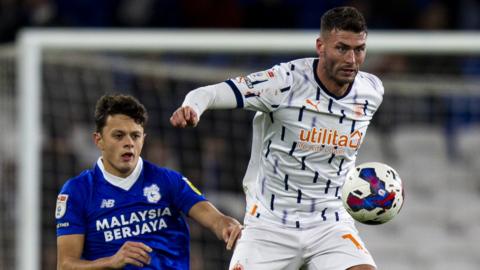 Perry Ng and Gary Madine (on the ball)