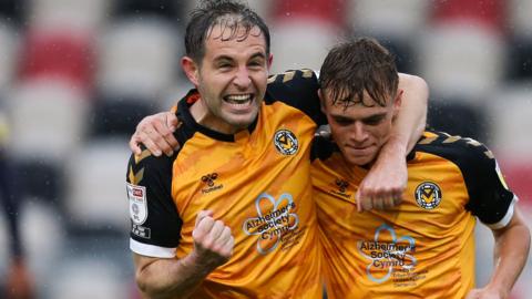 Matty Dolan of Newport County, left, celebrates with Scott Twine