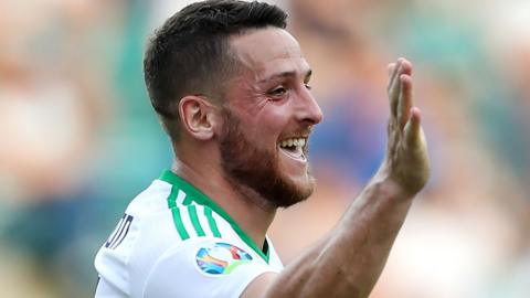 Conor Washington celebrates scoring for Northern Ireland against Estonia in 2019