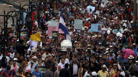 Friends and supporters carry the coffin of slain environmental rights activist Berta Caceres along a street during her funeral in the town of La Esperanza, outside Tegucigalpa