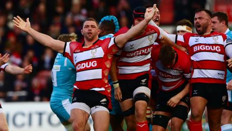 Gloucester players celebrate as a penalty call goes their way