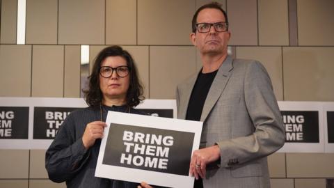 Sharon Lifschitz and Noam Sagi, two London-based British Israelis whose parents are among the hostages held by Hamas in Gaza, speaking at a Defend Israeli Democracy UK press conference at Plaza Westminster Bridge Hotel in London.