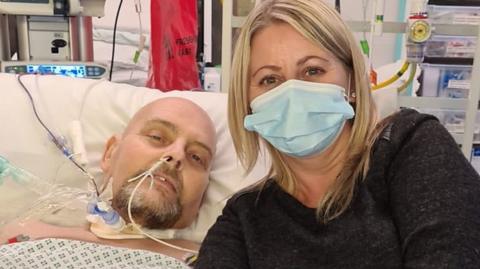 Wayne and wife Terri in hospital