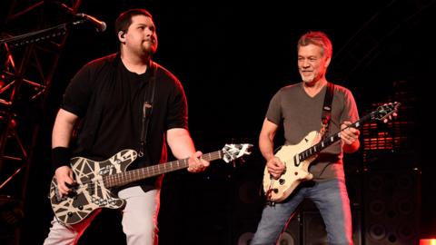 Wolfgang Van Halen on stage with his father Eddie