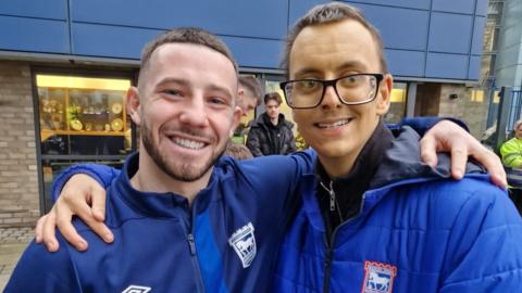 Conor Chaplin and Ben Moore outside Portman Road stadium posing for a photo