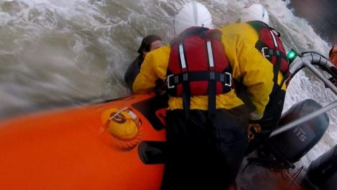 Surfer plucked out sea