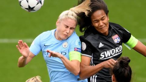 Steph Houghton and Wendie Renard challenge for a header