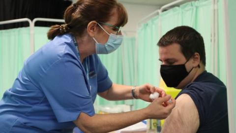 A man being vaccinated