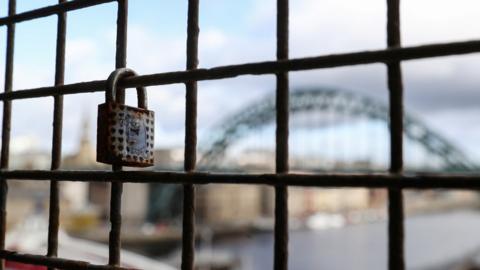 A lock on the High Level Bridge with the Tyne Bridge in the background