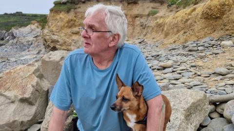 Phillip Woods with his dog Poppy