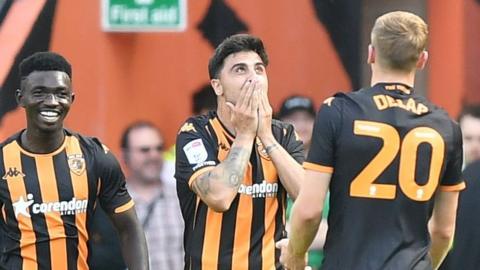 Ozan Tufan celebrates a goal for Hull