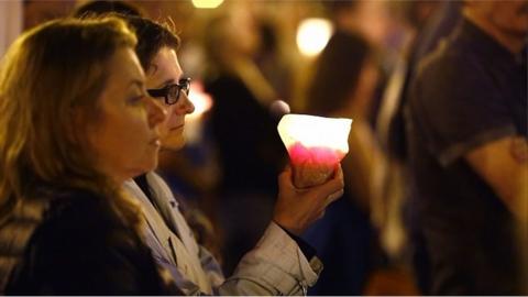 A protester holds a candle in Warsaw. 23 July 2017