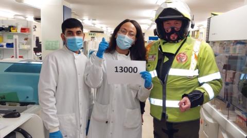 Martin Williams with two pathology workers.