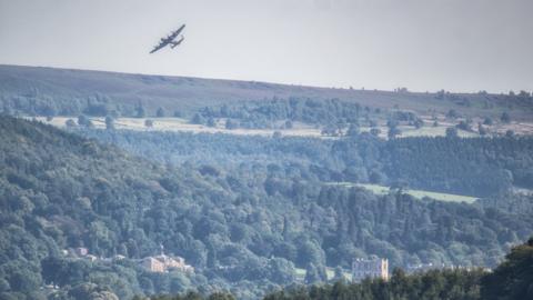 Lancaster Bomber flying over Chatsworth House, in Derbyshire