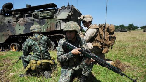 Philippine marines and their US counterparts taking part in annual Philippines-US amphibious landing exercise atnavy base facing the South China Sea in San Antonio, Zambales province, north of Manila. 9 October 2015