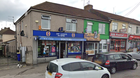 A wide shot of a row of shops including Fosters on New Cheltenham Road in Bristol