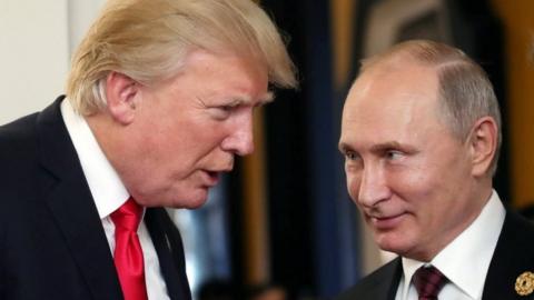 Russian President Vladimir Putin (R) and US President Donald J. Trump (L) talk at the break of a leader"s meeting at the 25th Asia-Pacific Economic Cooperation (APEC) summit in Da Nang, Vietnam, 11 November 2017