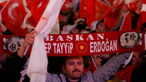 Supporters of Turkish President Erdogan celebrate as preliminary results of the constitutional referendum are announced in Ankara, Turkey