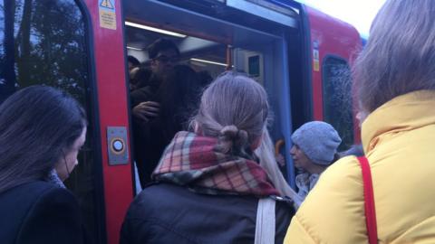 Commuters crowding on a train
