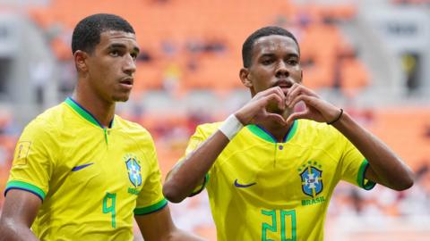 Brazil players celebrate after scoring