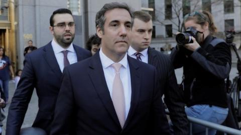 Michael Cohen departs federal court in Manhattan.