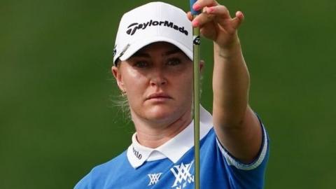 Charley Hull lining up a putt