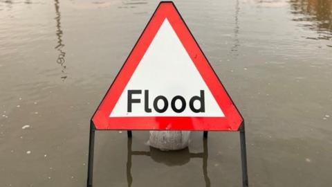 Flood sign in water