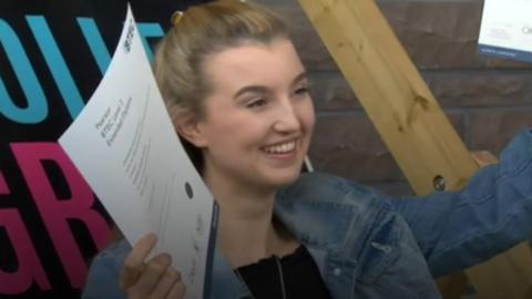 student celebrates getting her A-level results