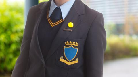 Schoolgirl dressed in school blazer
