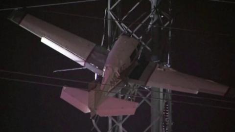 A plane tangled in power lines