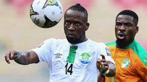 Sierra Leone forward Mohamed Buya Turay (left) vies with Ivory Coast defender Serge Aurier
