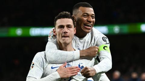 Benjamin Pavard celebrates with Kylian Mbappe