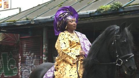 Yoruba woman on horse
