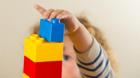 A child playing with building blocks