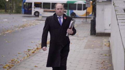 Man arriving at his trial at Crown Court