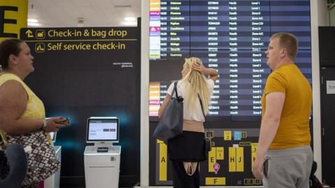 Travellers wait for their flights at Gatwick Airport in London, Britain, 31 May 2022. Holidaymakers across the UK face continuing travel disruptions due to flight cancellations and lack of airport and airline staff during the first school holidays in England and Wales since the lifting of all UK Covid-19 travel restrictions