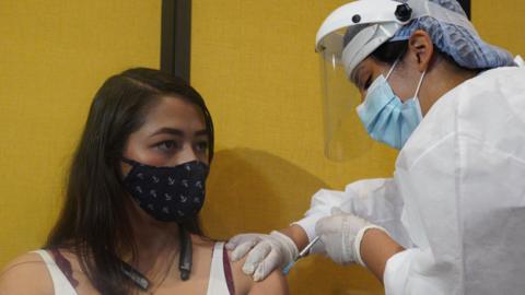 Johana Bautista gets vaccinated in Bogotá