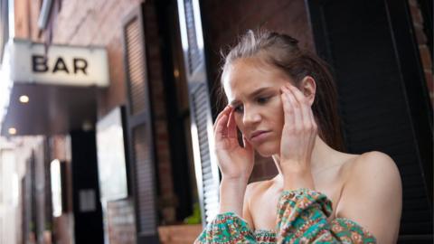 Woman outside bar