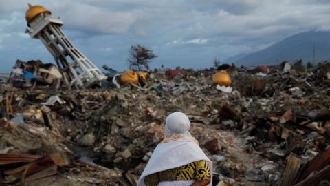 A woman who lost her nephew in last week"s earthquake stands in the Balaroa neighbourhood in Palu, Sulawesi Island, Indonesia October 7, 2018.