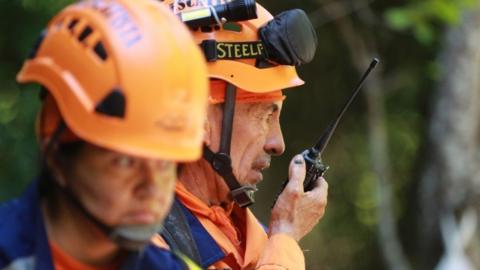 Members of the Colombian Civil Defense work during the rescue operation for the 14 miners trapped after an explosion at the La Mestiza mine in El Zulia, Colombia, 01 June 2022.