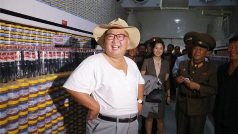 Kim Jong-un at a fish pickling factory