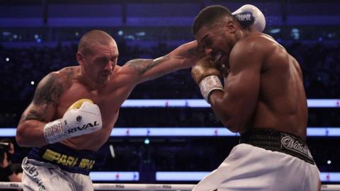 Oleksandr Usyk punches Anthony Joshua