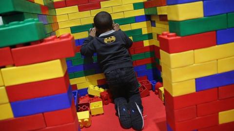 child with giant lego